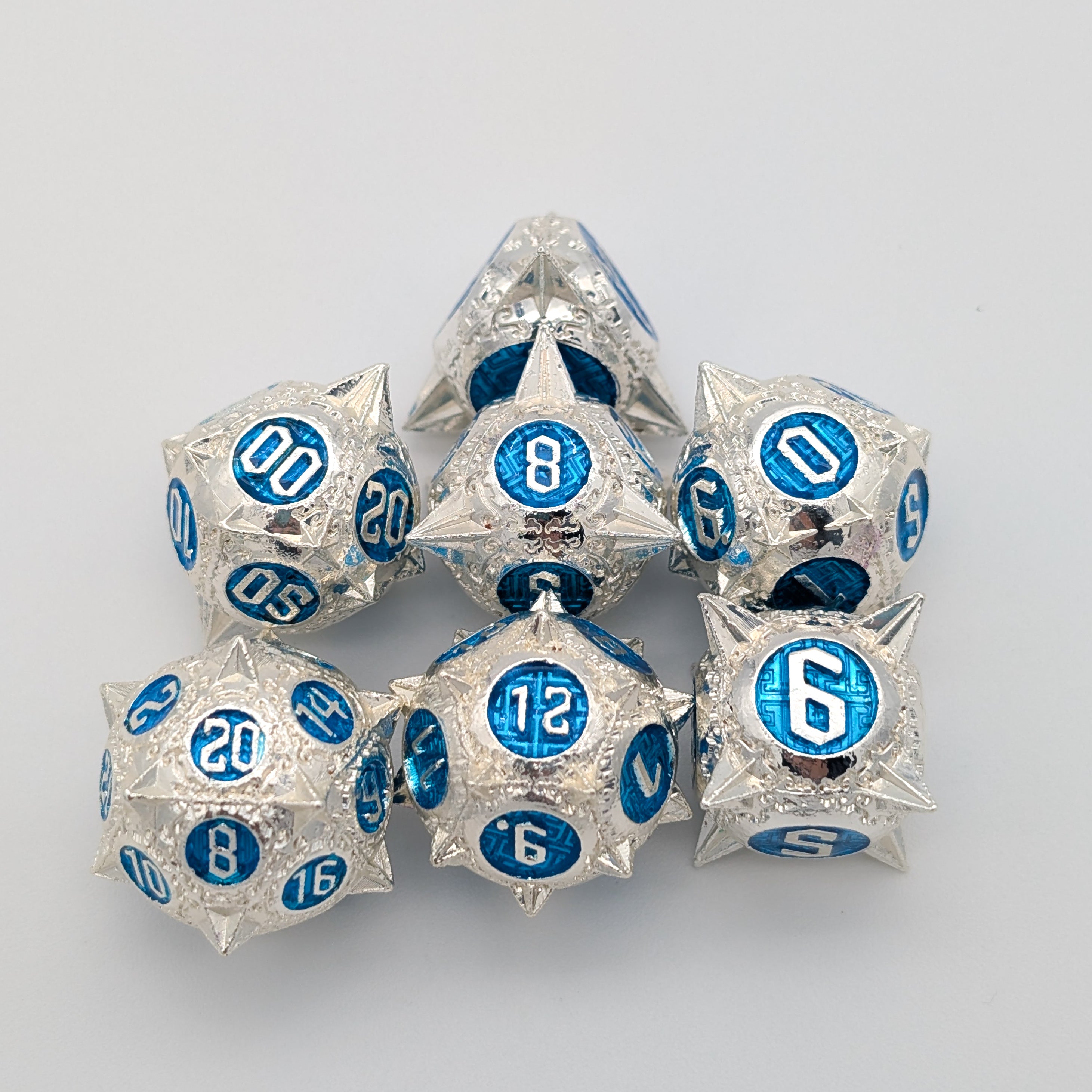 Caltrops Silver and Blue Metal Core Dice Set