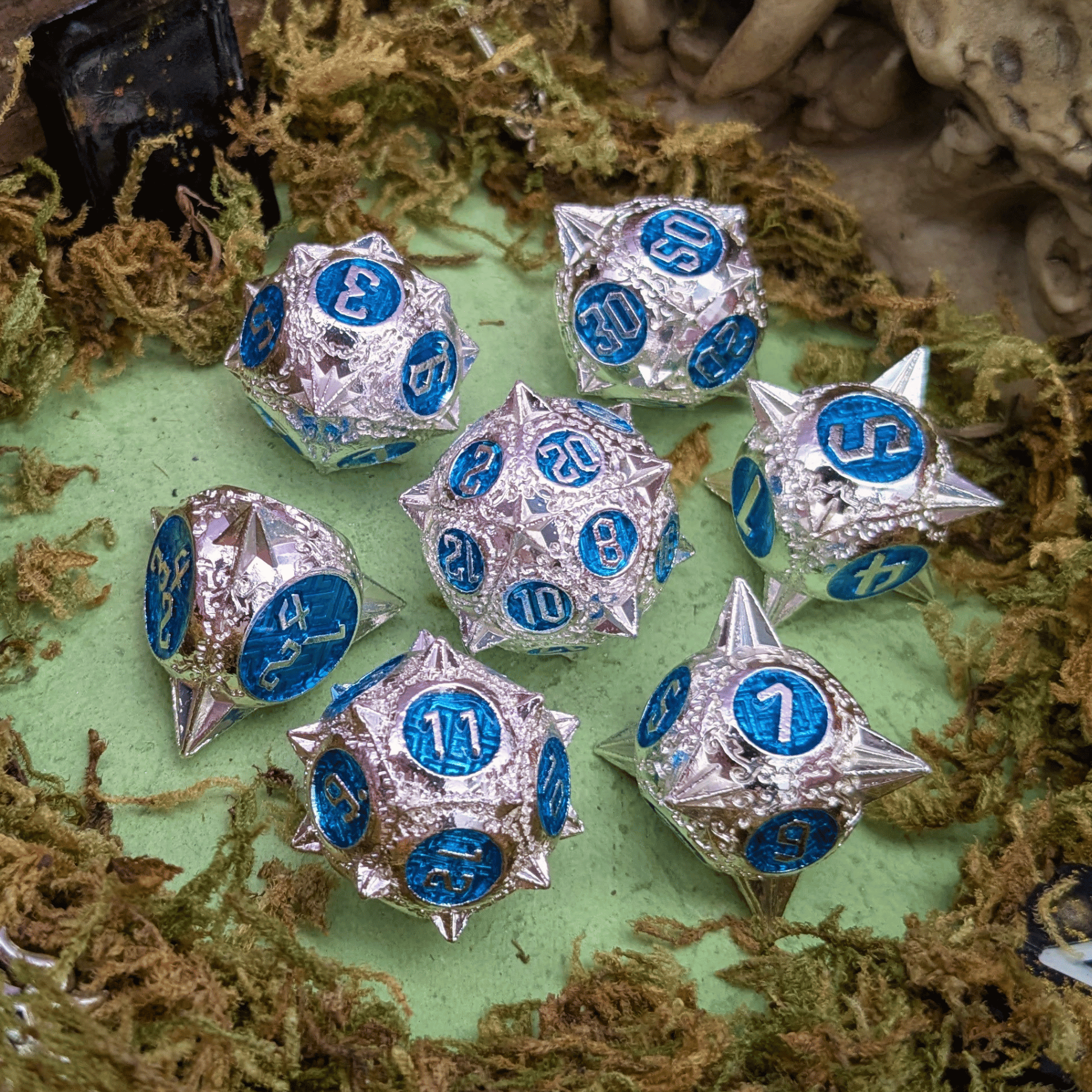 Caltrops Silver and Blue Metal Core Dice Set