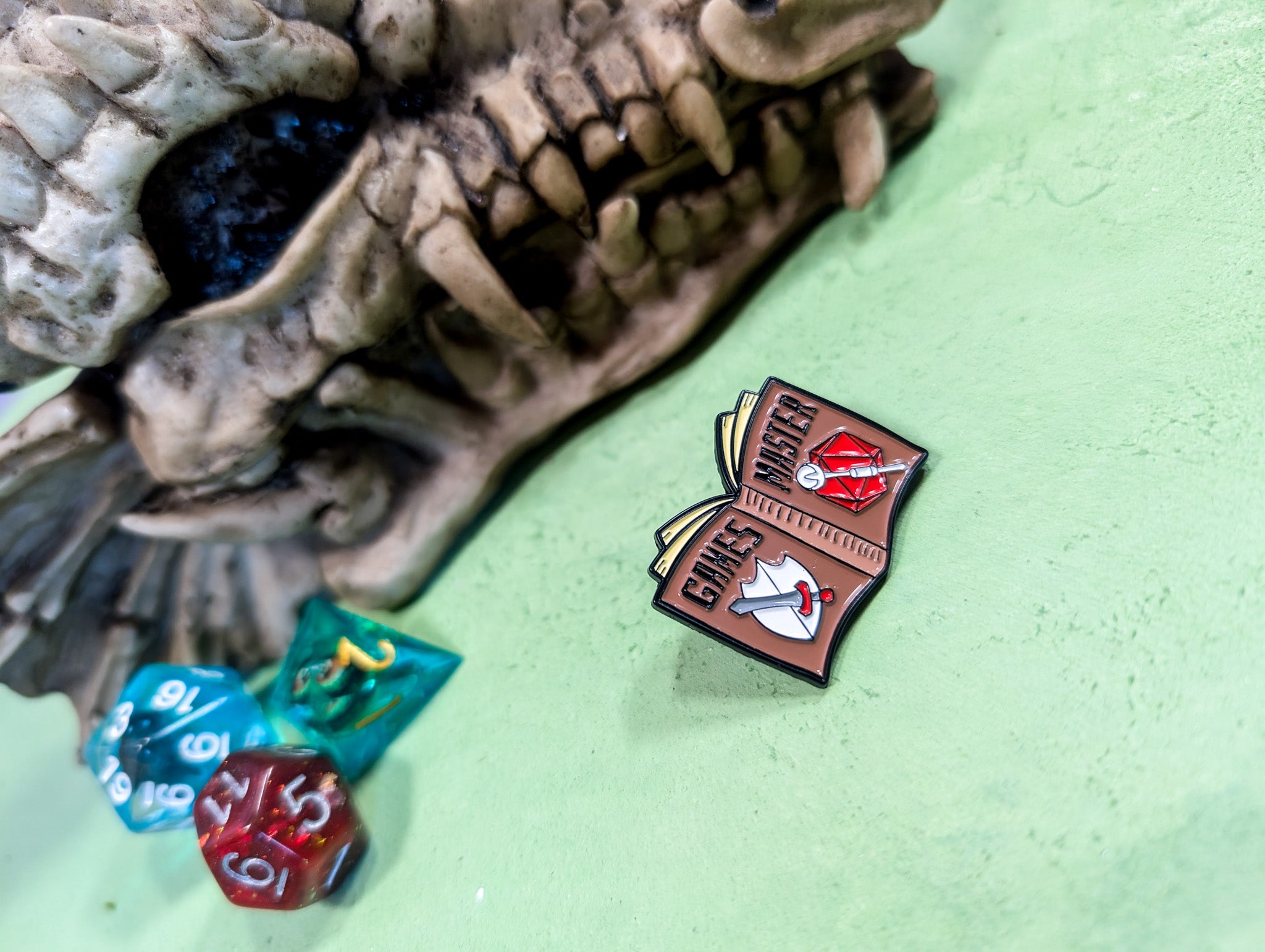 Games Master Book Pin