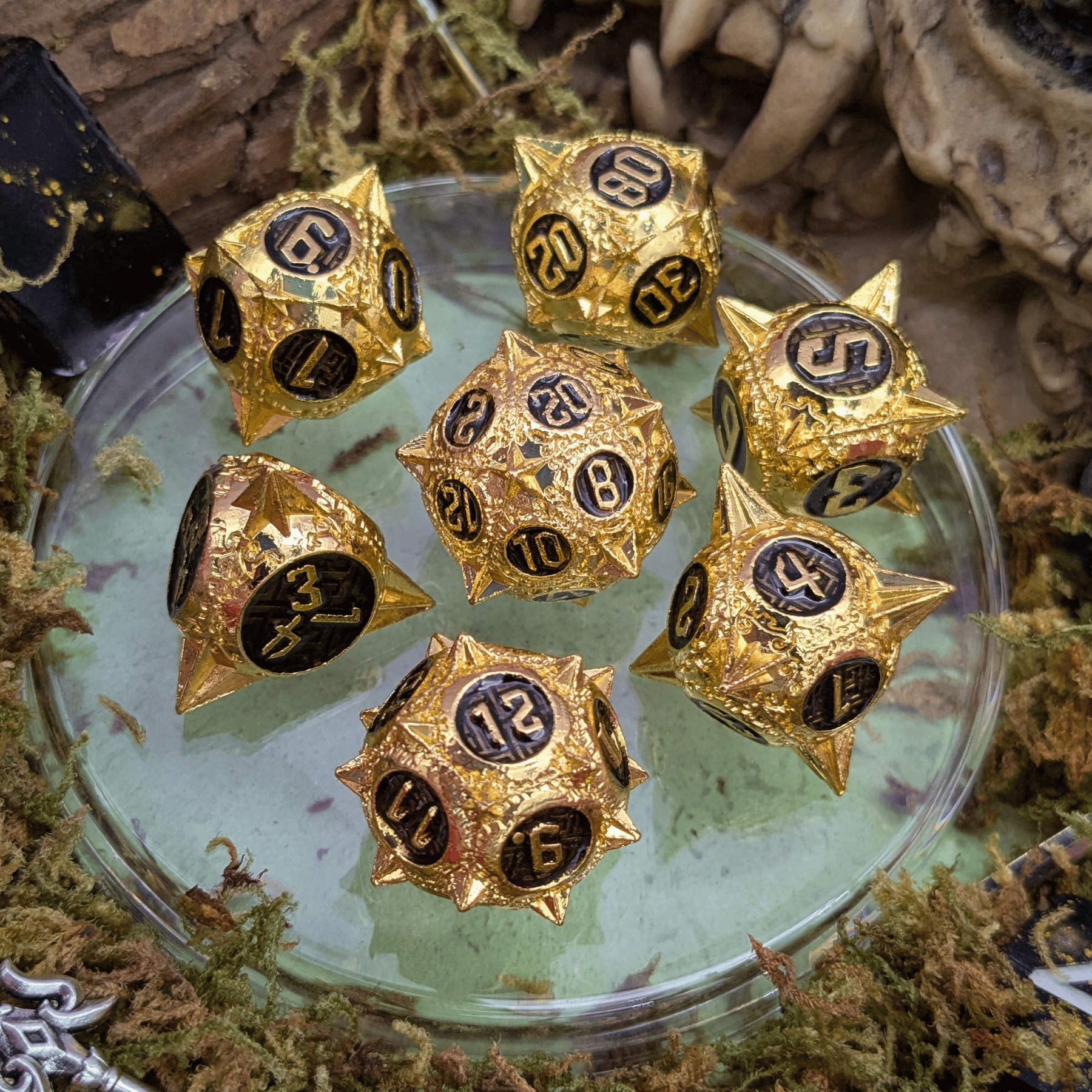 Caltrops Gold and Black Metal Core Dice Set