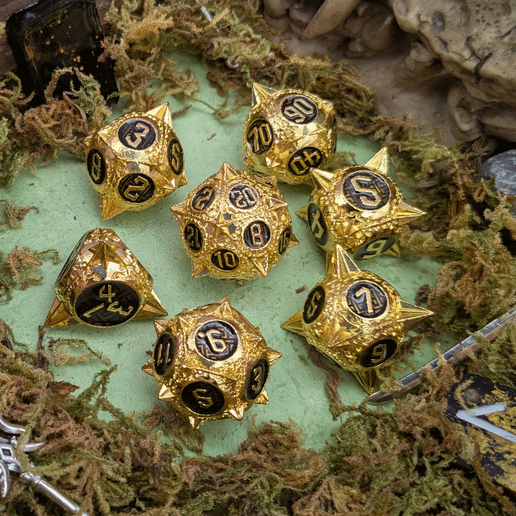 Caltrops Gold and Black Metal Core Dice Set