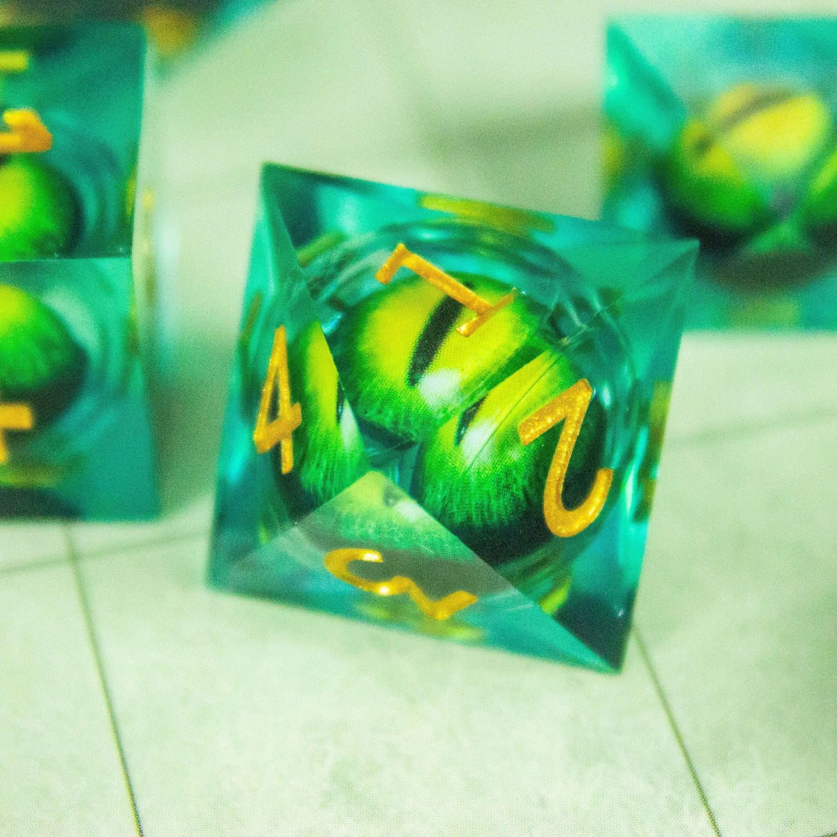 Liquid Core Moving Green Snake Eye TTRPG Dice. Sharp Edged Dice TTRPG - MysteryDiceGoblins