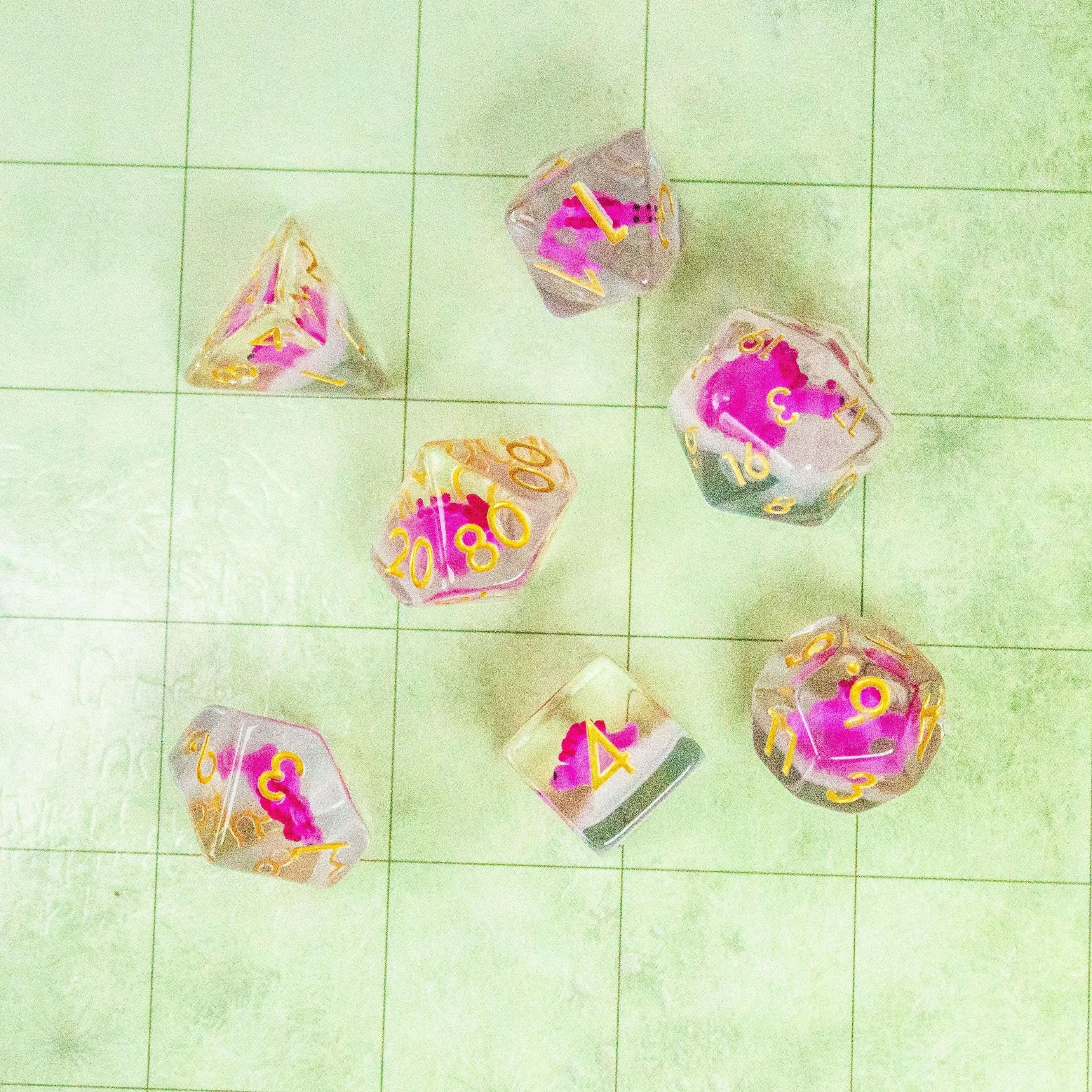 Pink Dinosaurs TTRPG Filled Dice Set| Transparent See through Dice (7) | Polyhedral Dice - MysteryDiceGoblins