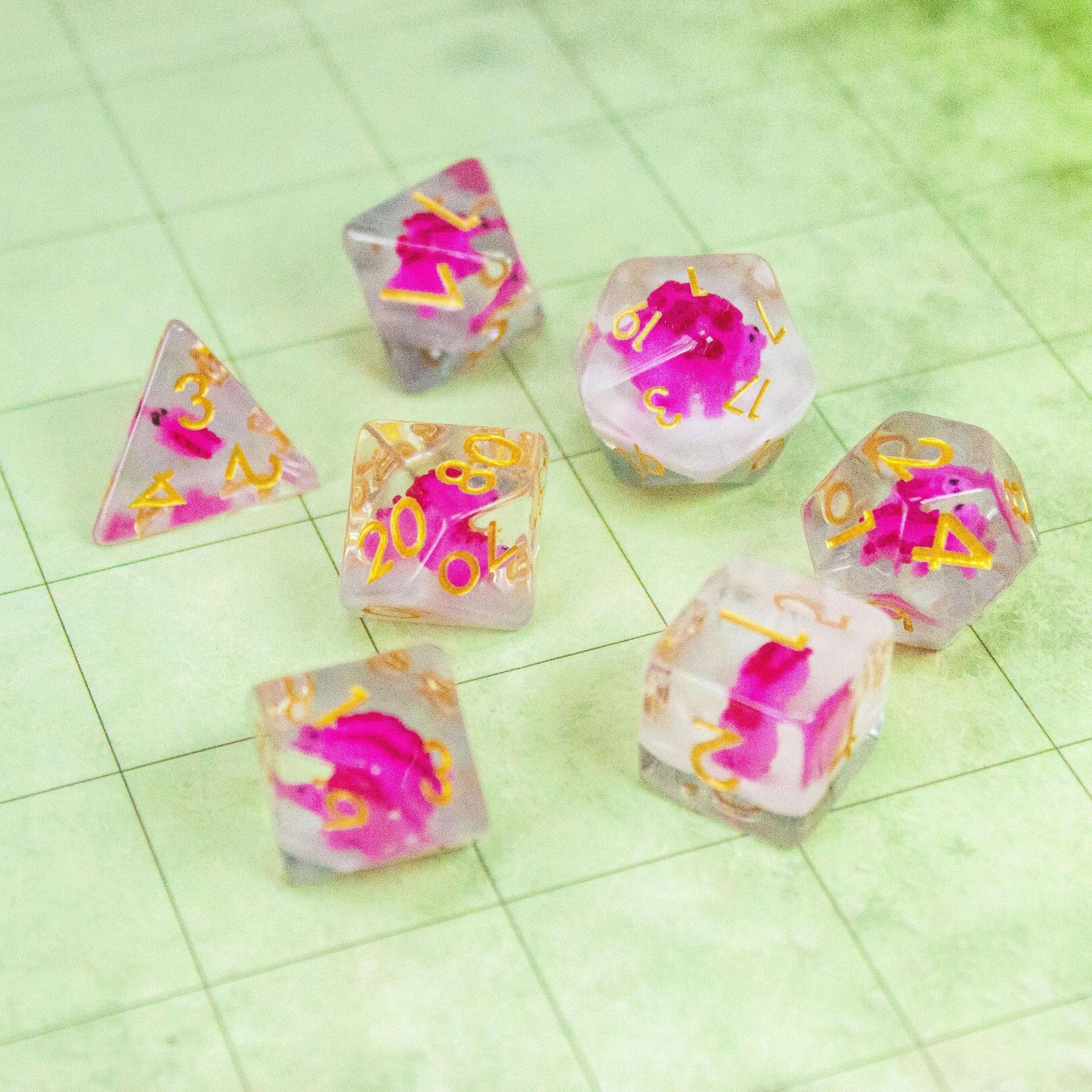 Pink Dinosaurs TTRPG Filled Dice Set| Transparent See through Dice (7) | Polyhedral Dice - MysteryDiceGoblins
