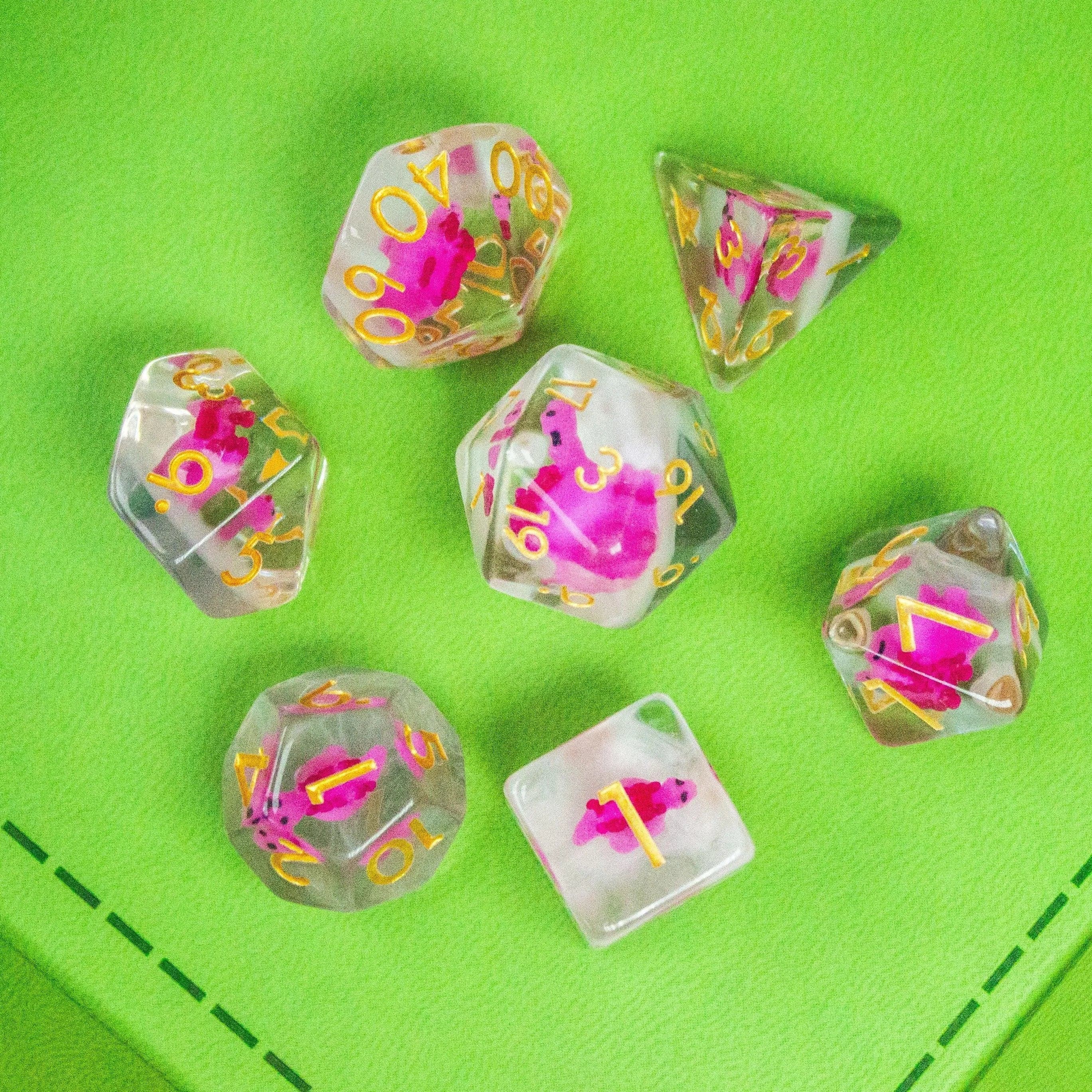 Pink Dinosaurs TTRPG Filled Dice Set| Transparent See through Dice (7) | Polyhedral Dice - MysteryDiceGoblins
