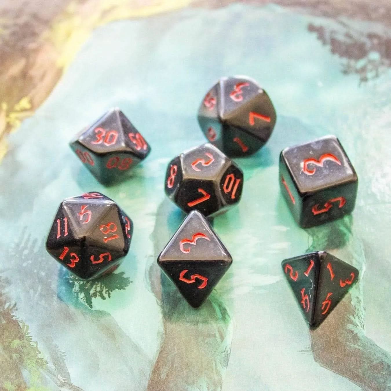 a grouping of dice in black and red - Mystery Dice Goblin