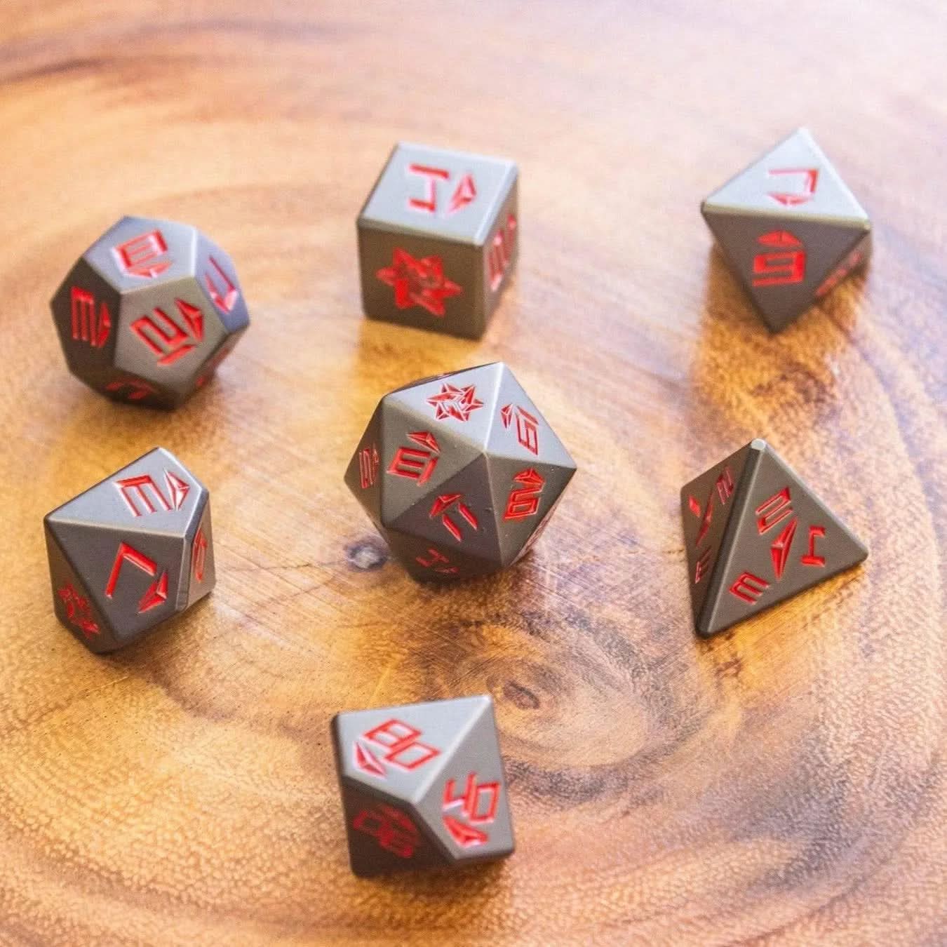 a top view of Metal Black and Red TTRPG  Dice Set - Mystery Dice Goblin