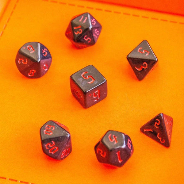 black dice with red writing- Mystery Dice Goblin