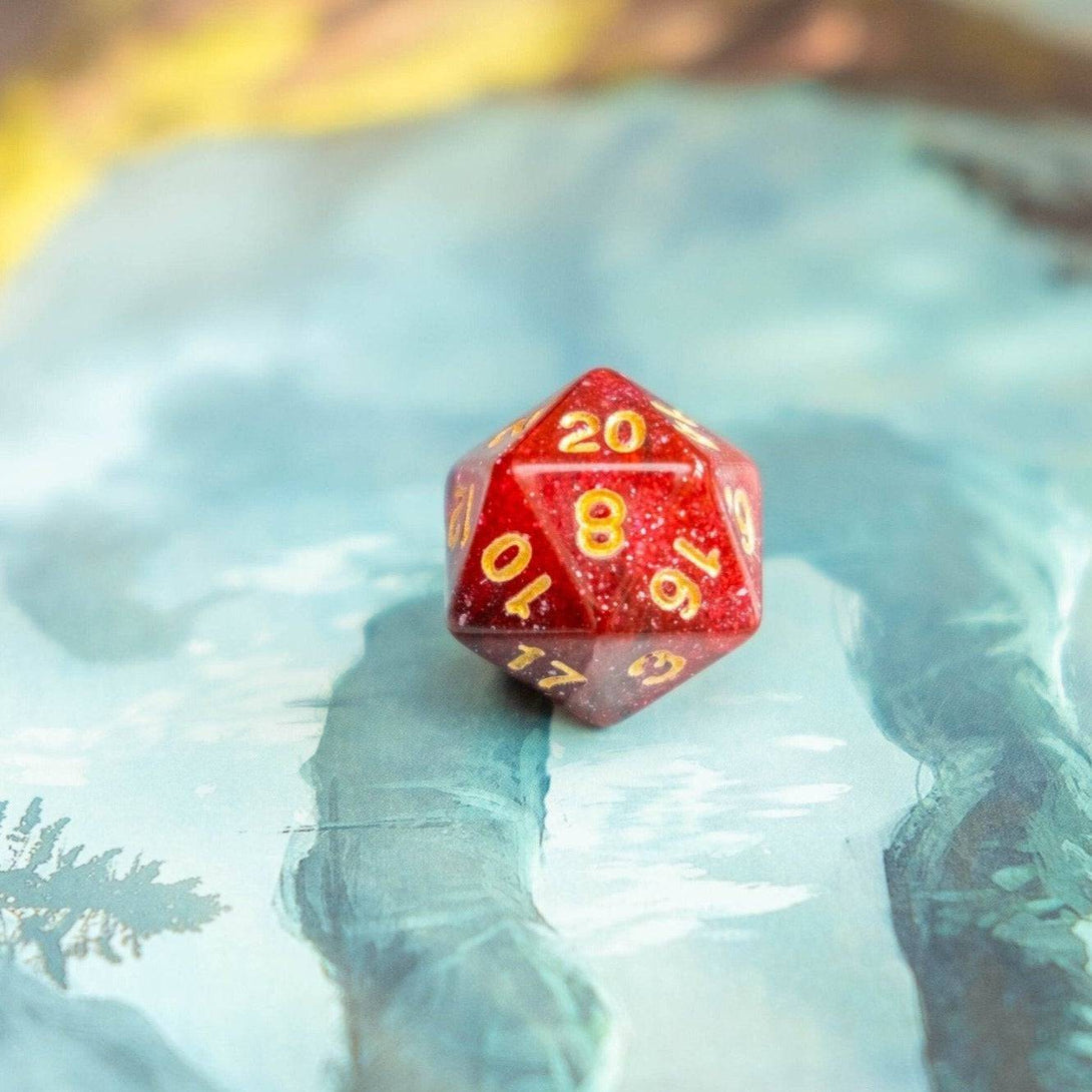 a red d20 laying on a dnd book - Mystery Dice Goblin