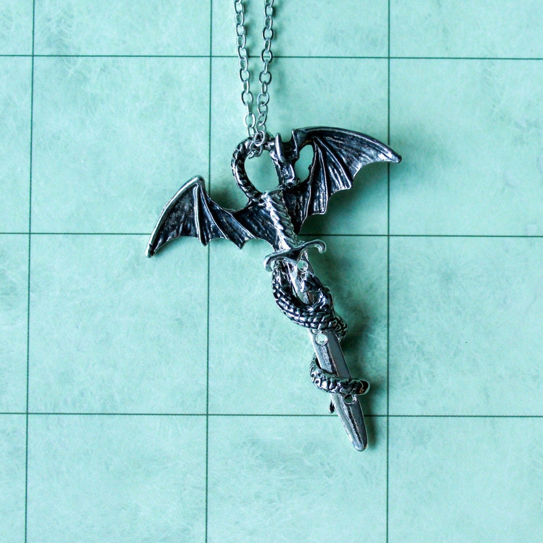 D&D Dragon Sword Necklace is a perfect gift idea for any tabletop adventurer. With a unique dragon design and easy to use, adjustable clasp. - MysteryDiceGoblins