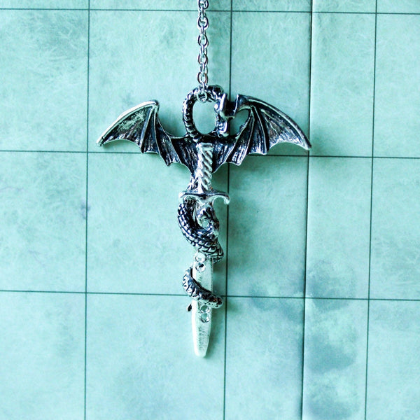 D&D Dragon Sword Necklace is a perfect gift idea for any tabletop adventurer. With a unique dragon design and easy to use, adjustable clasp. - MysteryDiceGoblins